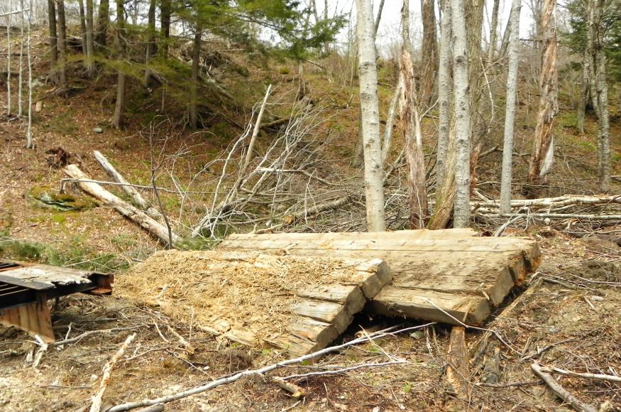 Wood decking from a portable bridge.