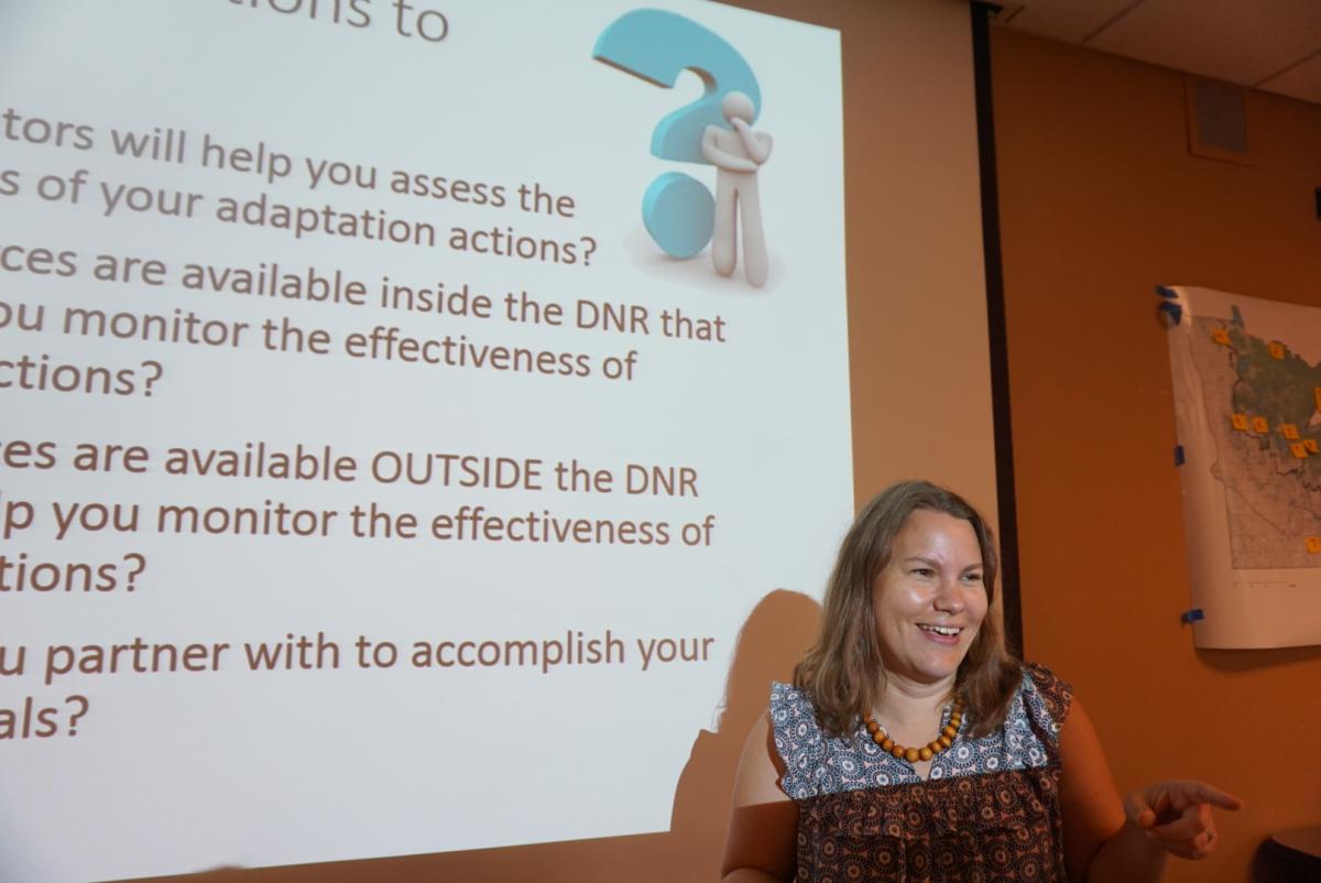 photo of a woman standing in front of her presentation